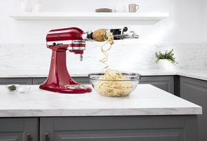 A KitchenAid® stand mixer using the spiralizer attachment.